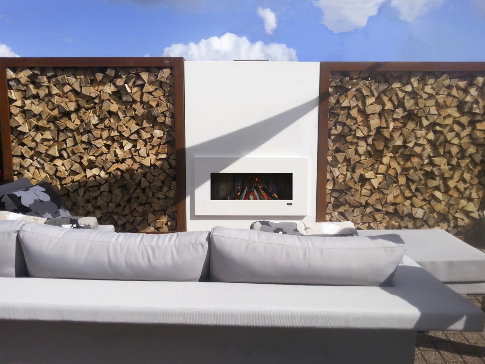 Foto: Zeno Retta custom made corten pieces woodstorage houtopslag buitenhaard tuinhaard terrashaard fireplace cheminee gartenkamin white