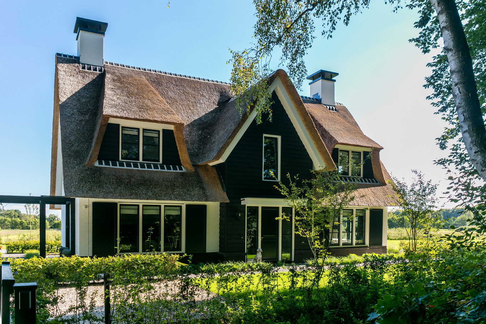Foto : Rietgedekte villa 'Koninginnenpage'