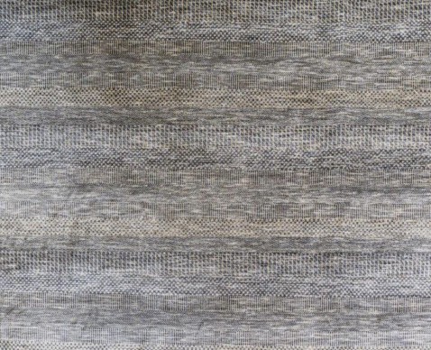 Foto : Handgeknoopt tapijt met etnisch patroon