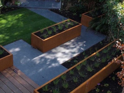 Foto : Hoe je tuin op te fraaien met een design plantenbak