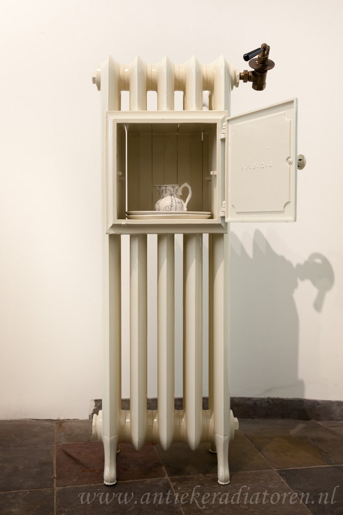 Foto: antieke bordenwarmer 26 a