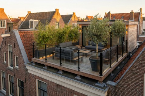 Foto : Sky High: De Realiteit van een Dakterras op Uw Aanbouw