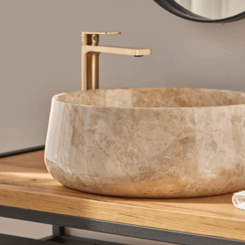 Foto: waskom natuursteen rond beige travertinlook opbouw