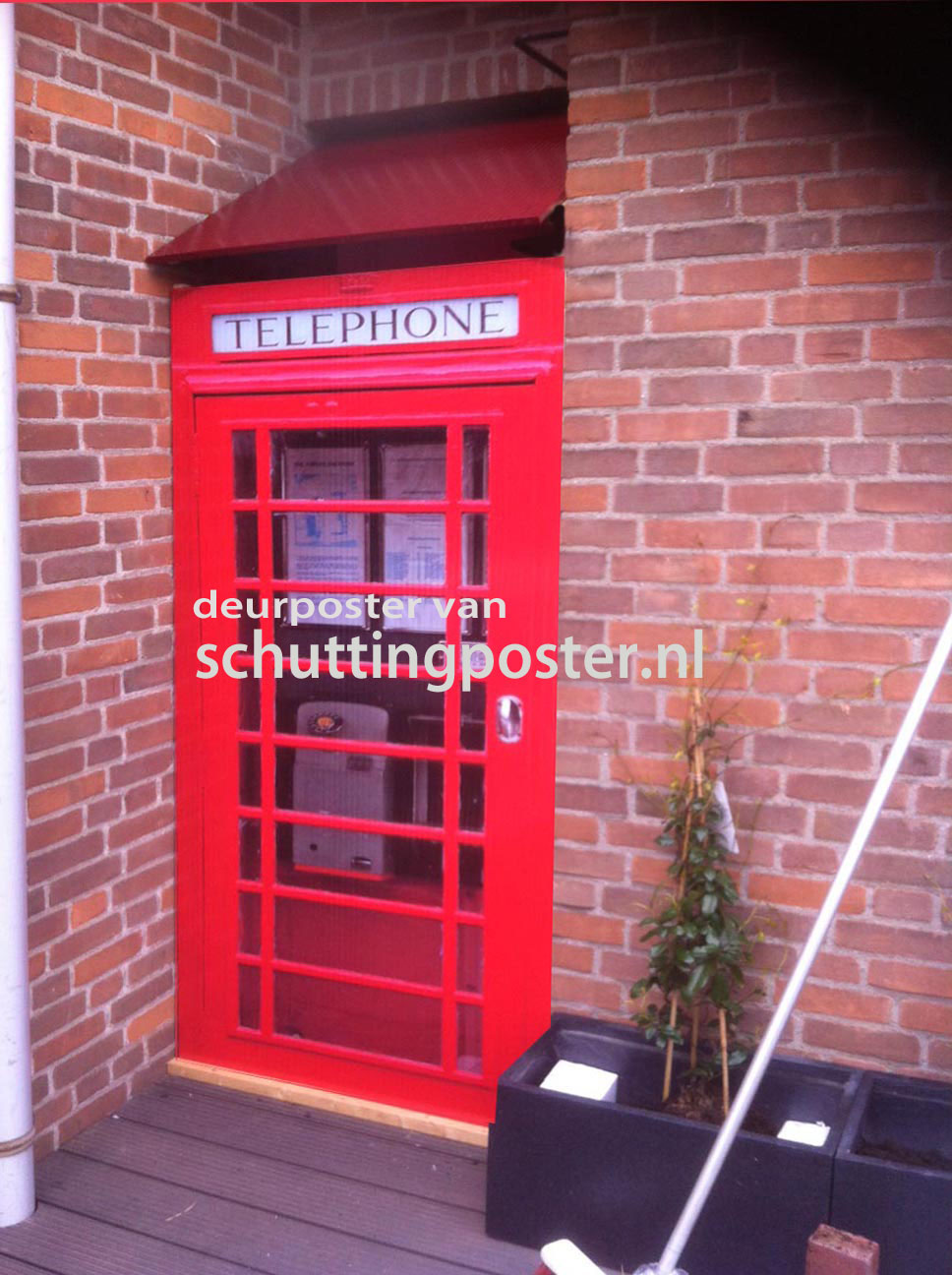 Foto: deurposter van schuttingposter op tuinpoort